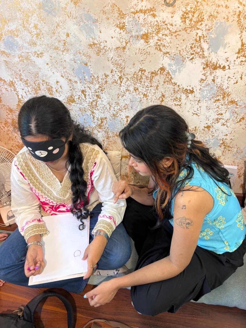 Students showing their art therapy work